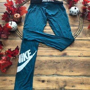 Nike dark teal legging with white logo on leg